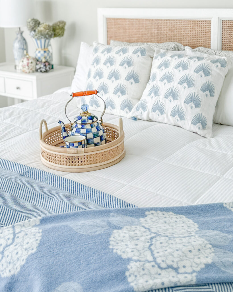 coastal blue bedroom with serena and lily pillows and chappy warp blankets