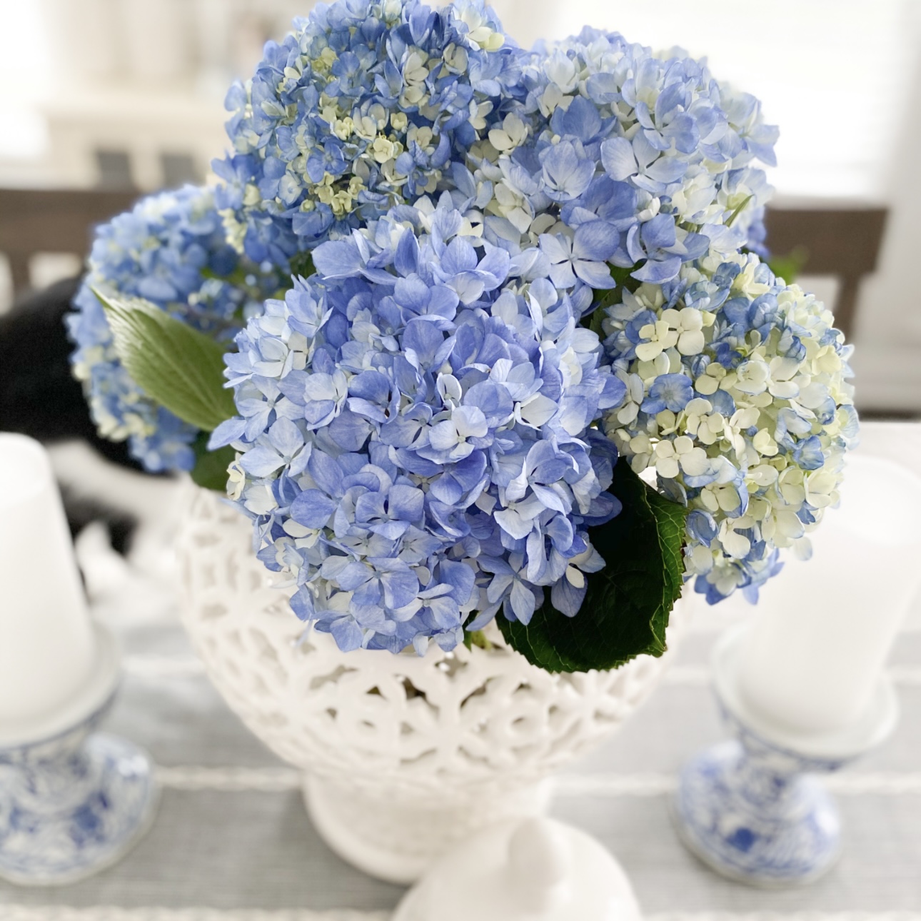 blue hydrangeas in a white ginger jar