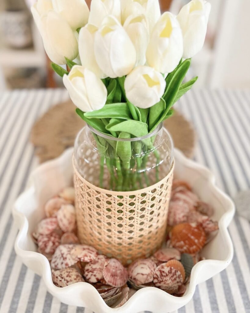 using shells as a centerpiece with flowers